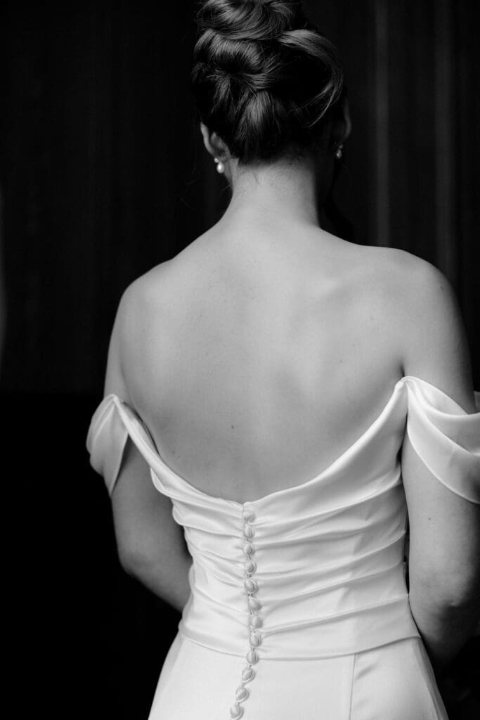Back detail of the bride’s wedding dress during preparations at The Edinburgh Grand
