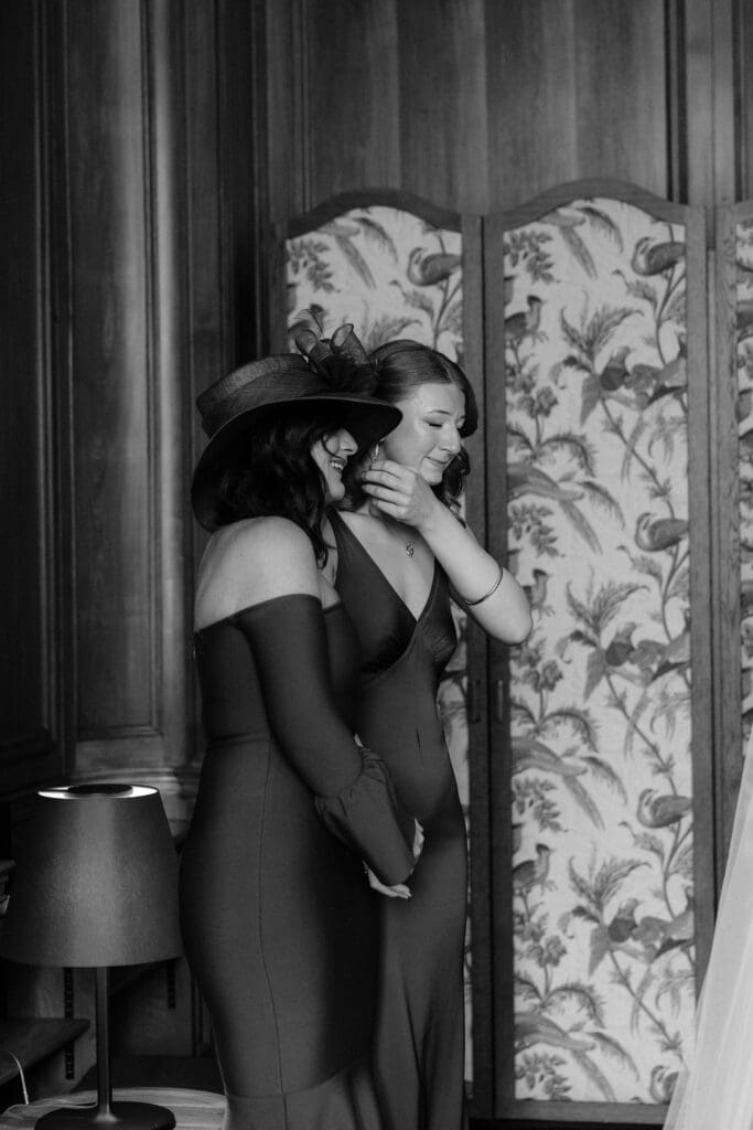 Bridesmaid sharing an emotional moment with brides mother during preparations at The Edinburgh Grand