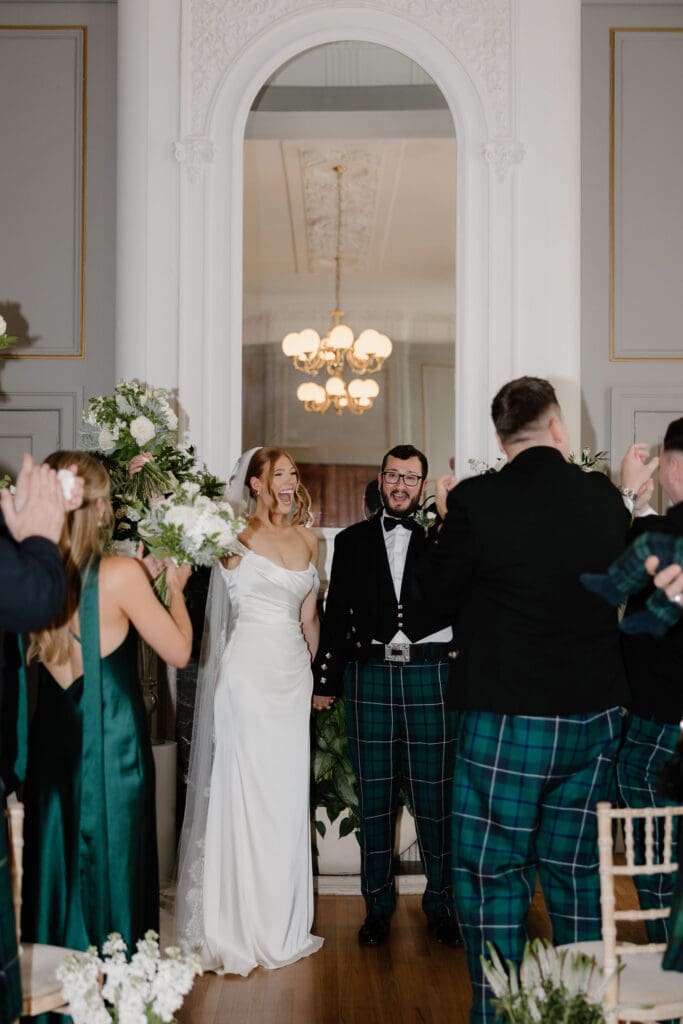 Bride and groom celebrating during their wedding ceremony at The Edinburgh Grand