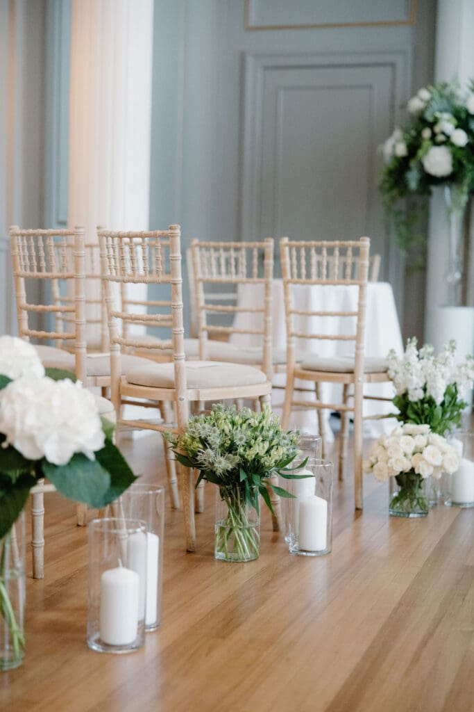Wedding ceremony chairs and floral arrangements at The Edinburgh Grand