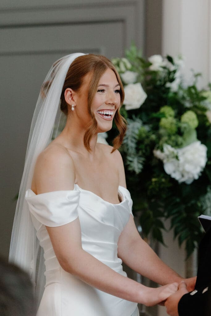 Bride smiling during the wedding ceremony at The Edinburgh Grand